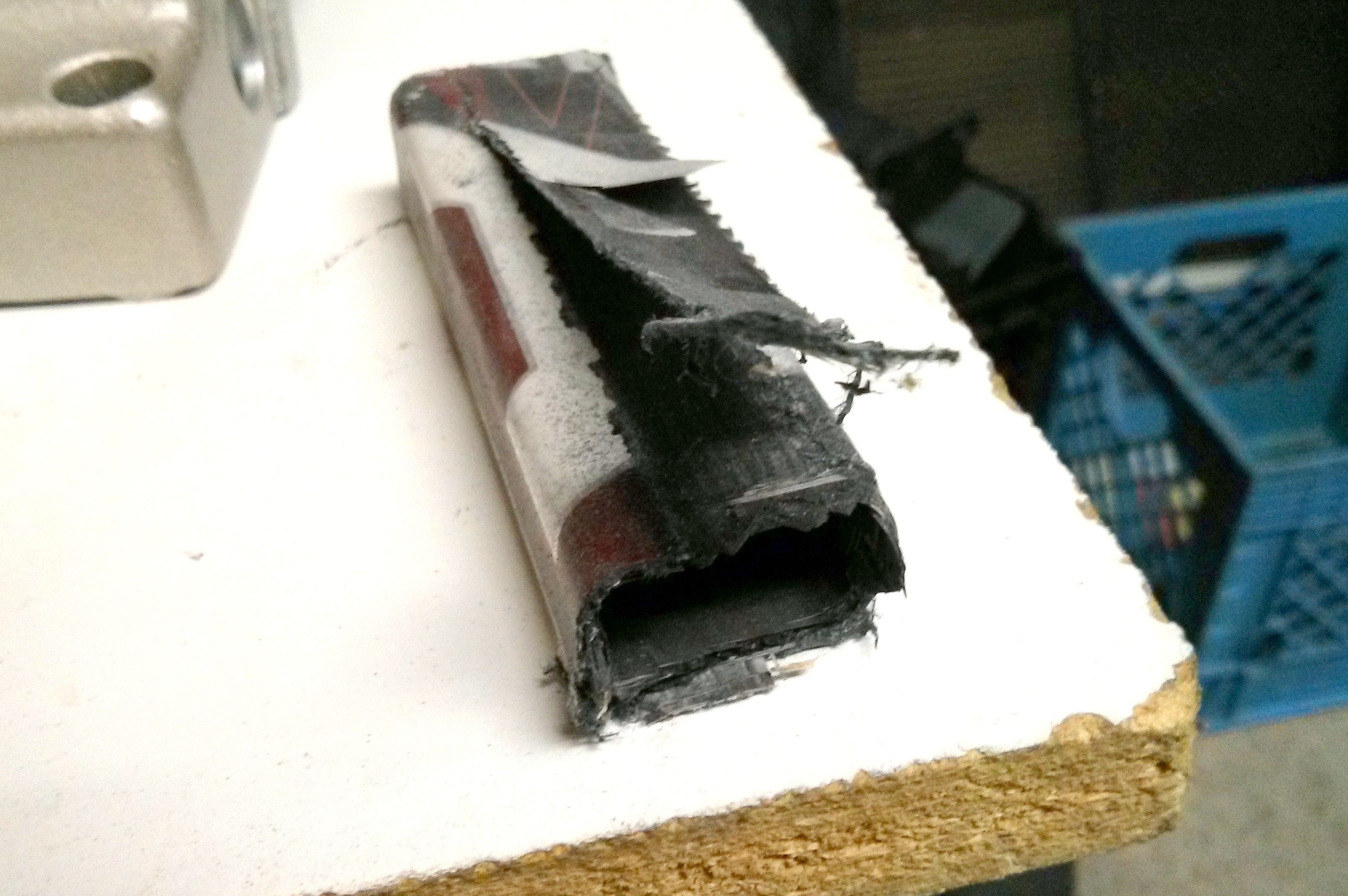 Delamination visible on a composite table surface